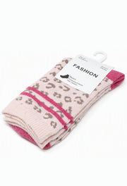 A pair of folded knit socks on a white hanger, featuring a light pink base with a brown leopard print pattern and bright pink horizontal stripes, with a white paper label that reads 'FASHION'.